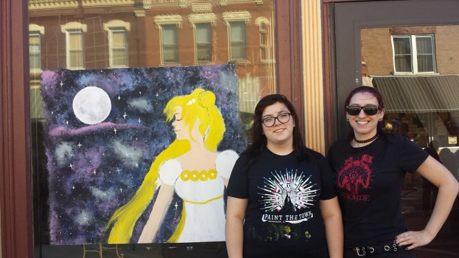 Recently, Heather and her daughter, Demi, created rapid tempura paintings on a window and the street during a local art festival.